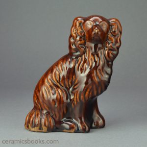 Treacleware (Rockingham glaze) spaniel dog figure. Probably Staffordshire. c.1850-1880. Obverse. AP/993.