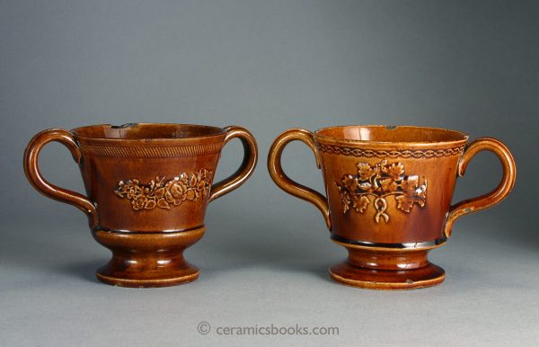 Two treacleware ('Rockingham' type glaze) chocolate cups or possibly loving cups. c.1840-1860. AP/393, AP/394.
