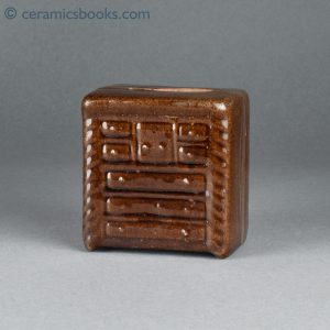 Treacleware chest of drawers moneybox. Eight drawers. c.1865-1885. Obverse.