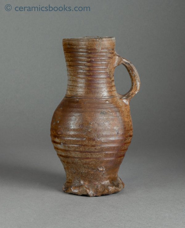 Medieval salt-glazed stoneware jug, probably early Siegburg c.1375-1450. Obverse.