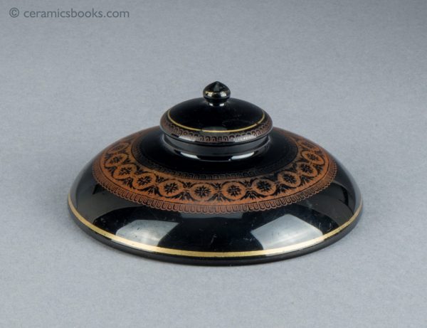 A Jackfield type inkwell, in a very low dome shape. Side view 1.