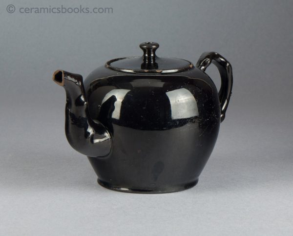 'Jackfield' type black-glazed globular teapot with crabstock handle and spout. c.1765-1780. Spout.