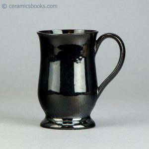 Small "Jackfield" type black glazed mug. c.1765-1785. AP/605. Obverse.