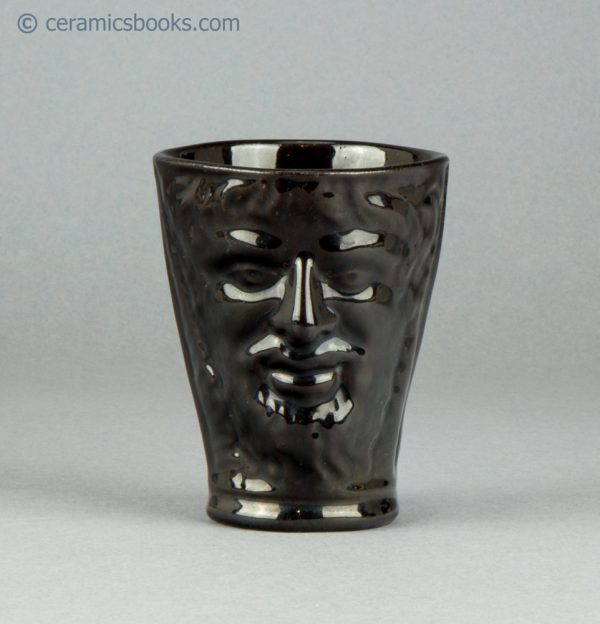 "Jackfield" type Bacchus cup or beaker with two faces. c.1775-1800. AP/689. Obverse.