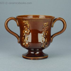 Treacleware loving cup with grapevine sprigs. c.1840-1870. AP/1009. Obverse.