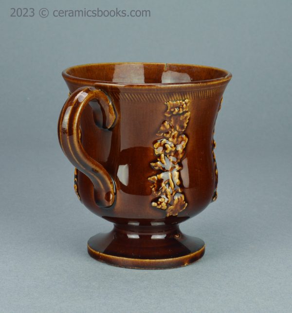 Treacleware loving cup with grapevine sprigs. c.1840-1870. AP/1009. Right side.