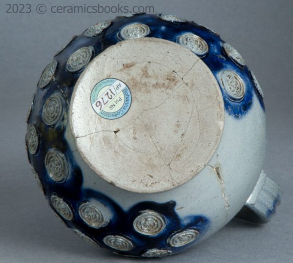Westerwald saltglaze stoneware mask jug with roundels. c.1665-1680. AP/1276. Base.
