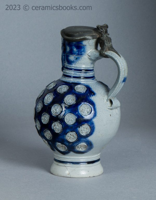 Westerwald saltglaze stoneware mask jug with roundels. c.1665-1680. AP/1276. Obverse back.