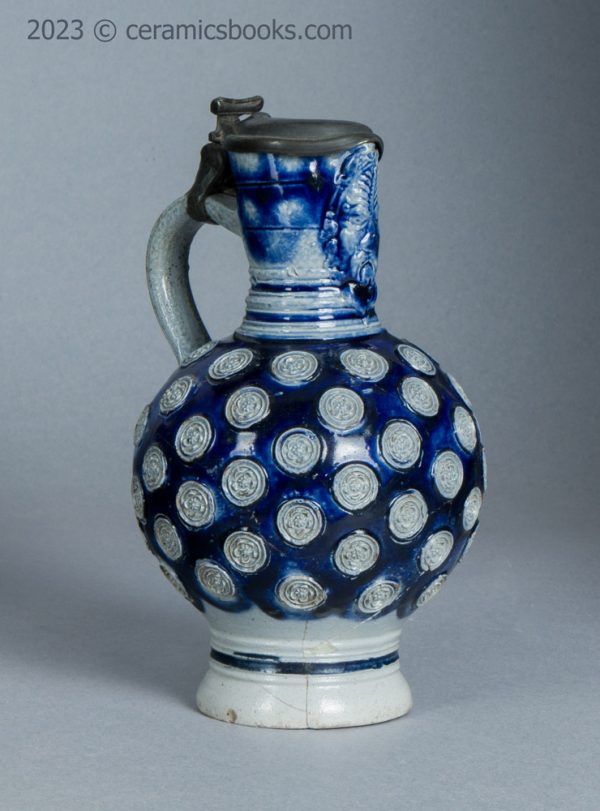 Westerwald saltglaze stoneware mask jug with roundels. c.1665-1680. AP/1276. Reverse front.