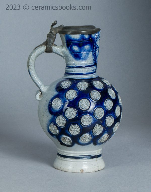 Westerwald saltglaze stoneware mask jug with roundels. c.1665-1680. AP/1276. Reverse.