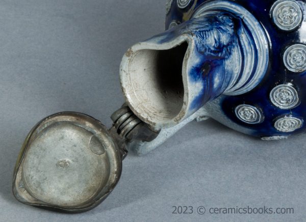 Westerwald saltglaze stoneware mask jug with roundels. c.1665-1680. AP/1276. Rim.