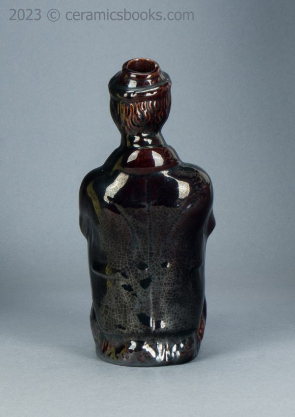 Treacleware spirit flask, old man with walking stick. c.1840-1865. AP/1370. Back.