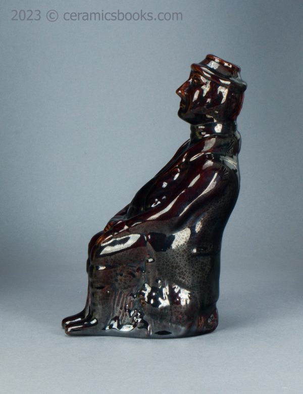 Treacleware spirit flask, old man with walking stick. c.1840-1865. AP/1370. Obverse.