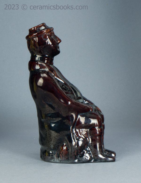 Treacleware spirit flask, old man with walking stick. c.1840-1865. AP/1370. Reverse.