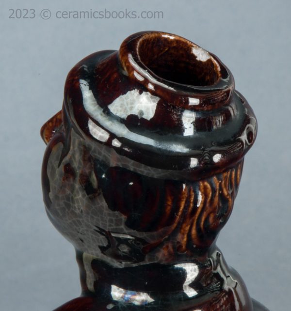 Treacleware spirit flask, old man with walking stick. c.1840-1865. AP/1370. Rim.