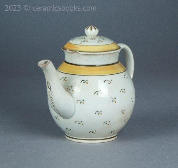 Bachelor or child prattware teapot with flowers. c.1800-1820. AP/1402. Front obverse.