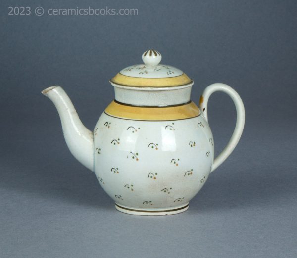 Bachelor or child prattware teapot with flowers. c.1800-1820. AP/1402. Obverse.