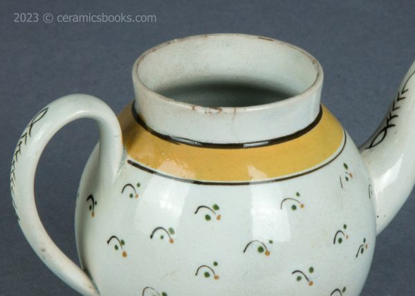 Bachelor or child prattware teapot with flowers. c.1800-1820. AP/1402. Rim.