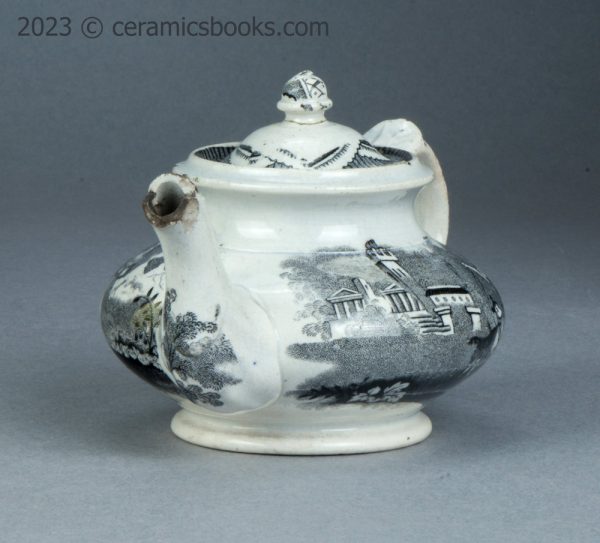 Child's size black transfer printed teapot. Possibly Godwin. c.1835-1845. AP/1563. Front obverse.