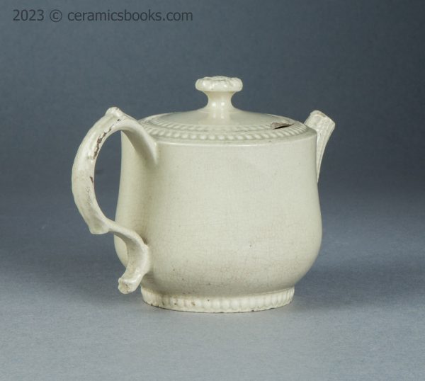 Small creamware teapot with rouletting. Staffordshire. c.1765-1785. AP/1564. Back reverse.