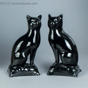 Pair of Jackfield type black cats. c.1865-1885. AP/1653/1145. Obverse angle.