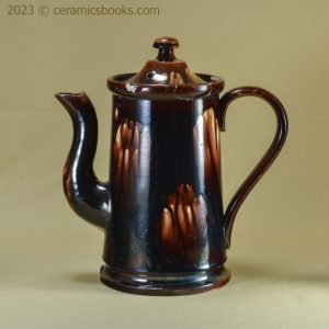 Two-tone treacleware (Rockingham glaze) coffee pot. Rare 'metal' shape. c.1840-1870. AP/762. Obverse.