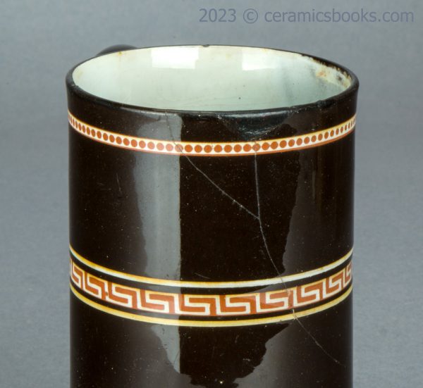 Redware 'mochaware' tankard with rouletting. c.1810-1830. AP/1046. Damage.