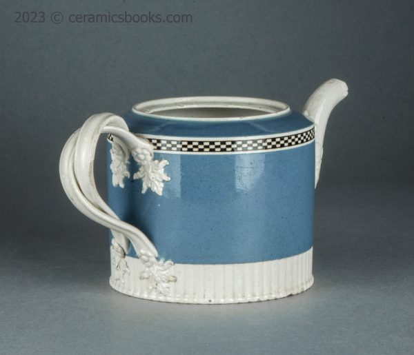 Neale & Co. blue slip 'mochaware' teapot. c.1784-1795. AP/1200. Back reverse.