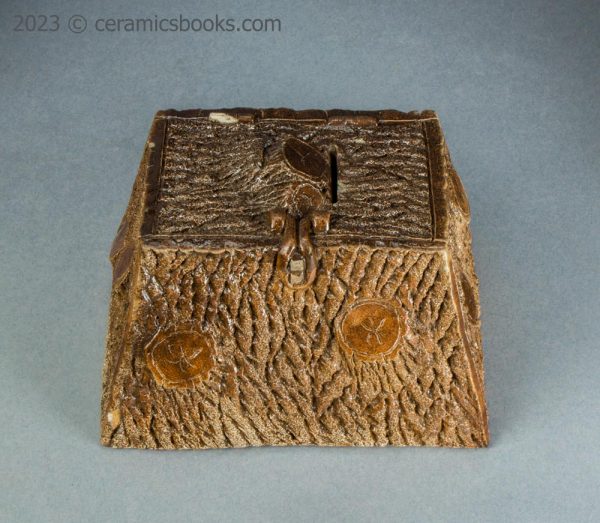 Salt-glazed stoneware moneybox. 'Wooden' box. c.1850-1880. AP/1225. Front above.