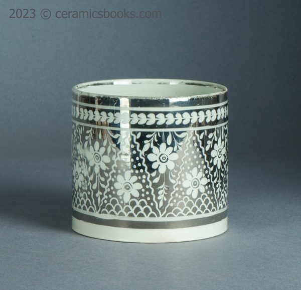 Silver resist lustreware mug with flowers. c.1810-1820. AP/1399. Front.