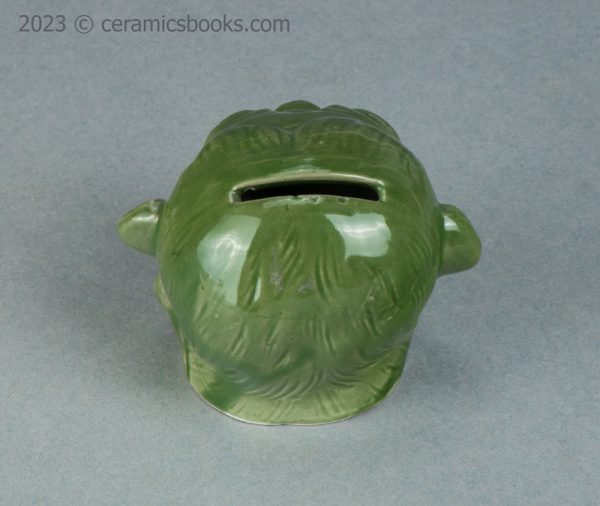 Green porcelainous monkey head moneybox. Austrian. c.1890-1917. AP/1413. Back above.