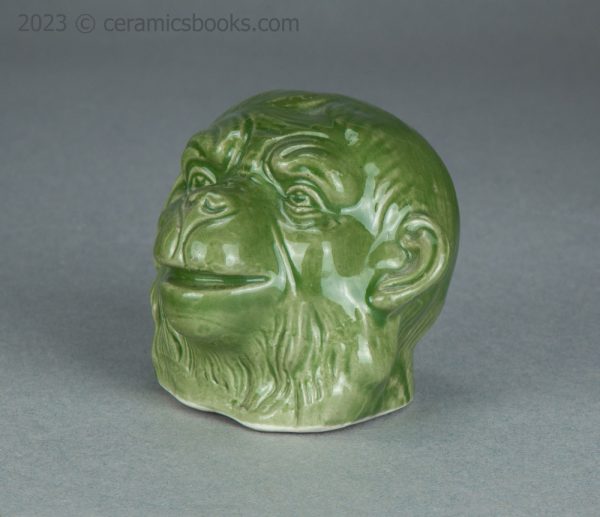 Green porcelainous monkey head moneybox. Austrian. c.1890-1917. AP/1413. Front obverse.