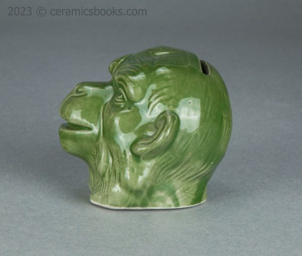 Green porcelainous monkey head moneybox. Austrian. c.1890-1917. AP/1413. Obverse.