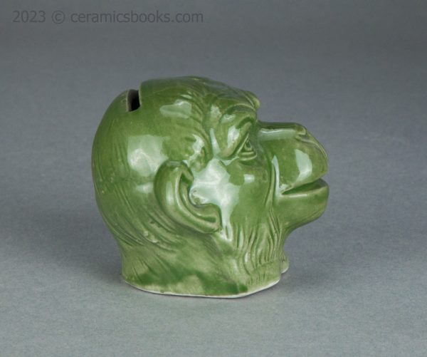 Green porcelainous monkey head moneybox. Austrian. c.1890-1917. AP/1413. Reverse.