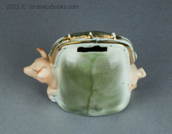 German porcelain pig in a purse moneybox. c.1920-1925. AP/1421. Above.