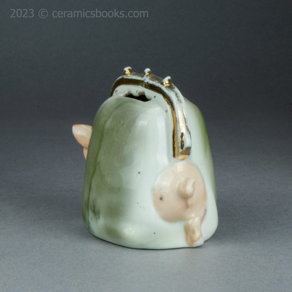 German porcelain pig in a purse moneybox. c.1920-1925. AP/1421. Back.