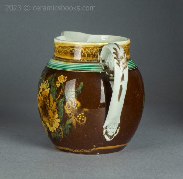 Pearlware jug with brown slip ground and flowers. c.1800-1830. AP/1500. Back.