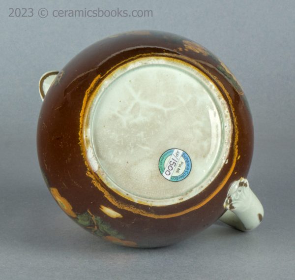 Pearlware jug with brown slip ground and flowers. c.1800-1830. AP/1500. Base.
