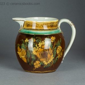 Pearlware jug with brown slip ground and flowers. c.1800-1830. AP/1500. Obverse.