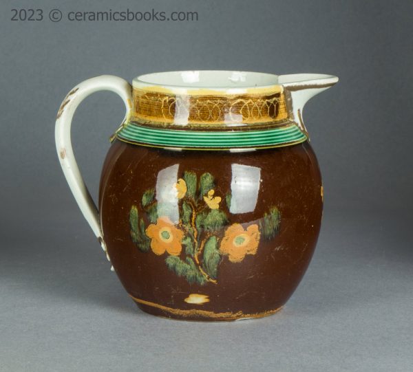 Pearlware jug with brown slip ground and flowers. c.1800-1830. AP/1500. Reverse.