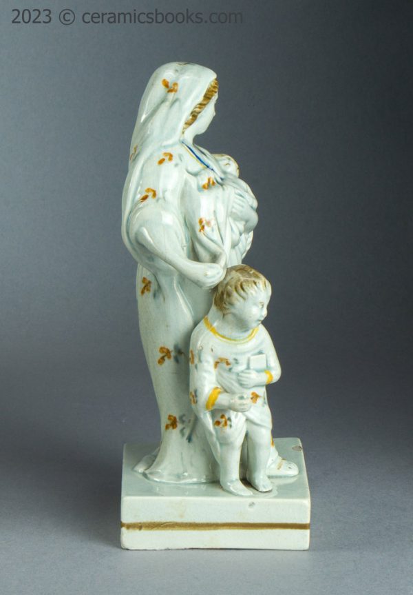 Prattware figure of Charity. Staffordshire. c.1790-1810. AP/1632. Reverse with prop.