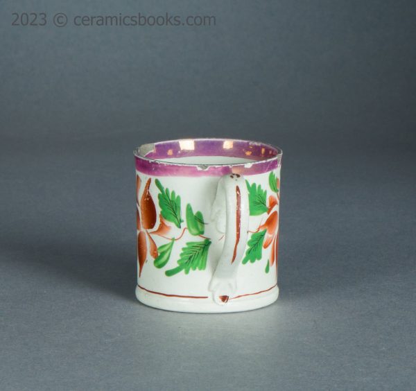 Child's toy mug. Pink lustreware with enamelled flowers. c.1825-1850. AP/1714. Back.