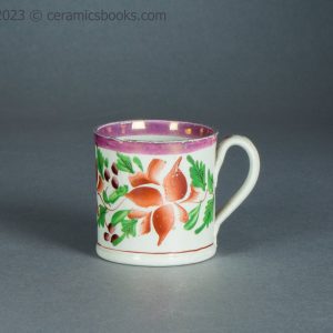 Child's toy mug. Pink lustreware with enamelled flowers. c.1825-1850. AP/1714. Obverse.
