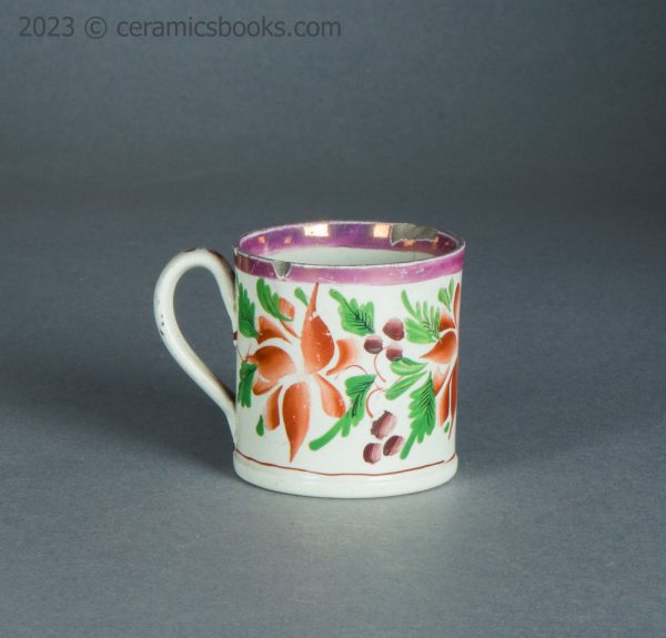 Child's toy mug. Pink lustreware with enamelled flowers. c.1825-1850. AP/1714. Reverse.