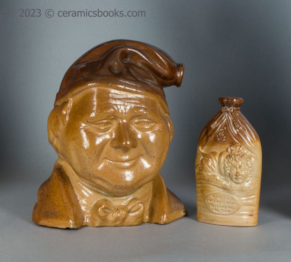 Salt-glazed stoneware Souter Johnny spirits flask and Mr & Mrs Caudle flask group. c.1840-1850. AP/704 and AP/1540.