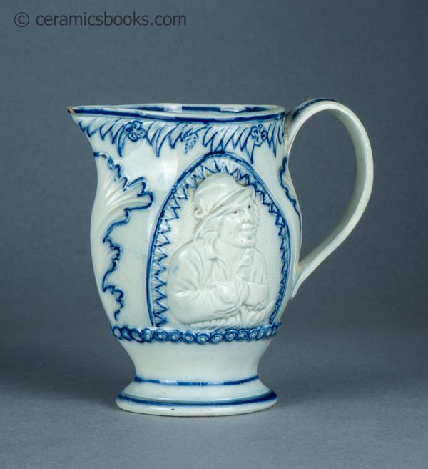 Pearlware jug, underglaze blue painted decoration. The Snuff Taker. c.1795-1815. AP/1388. Obverse angle.