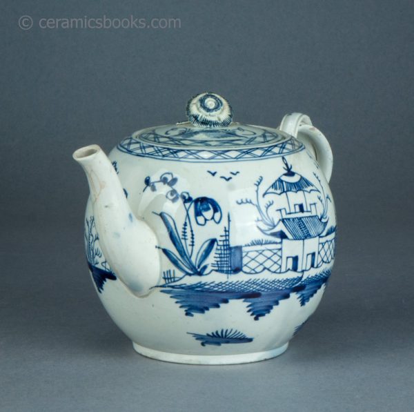 Pearlware teapot, painted blue underglaze Chinese House pattern. Attributed to Leeds Pottery. c.1780-1790. AP1401. Front obverse.