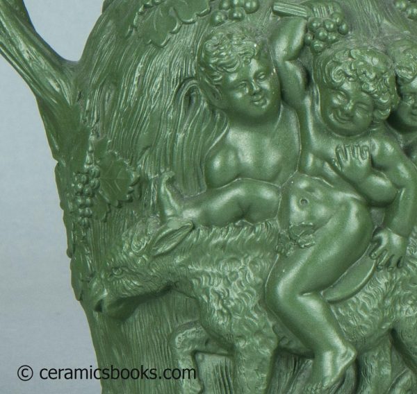 Green stoneware moulded jug. Drunken Silenus, Minton. c.1831-1840. AP/1452. Ear chip.