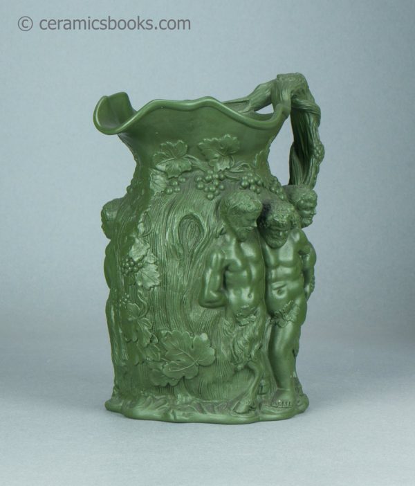 Green stoneware moulded jug. Drunken Silenus, Minton. c.1831-1840. AP/1452. Front obverse.