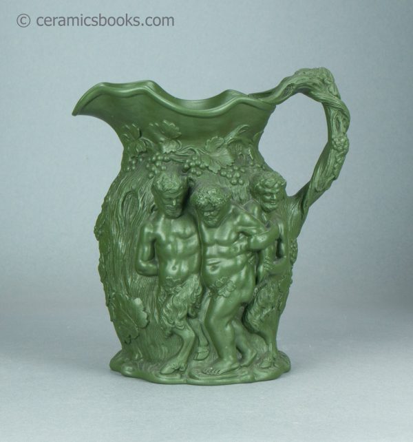 Green stoneware moulded jug. Drunken Silenus, Minton. c.1831-1840. AP/1452. Obverse.